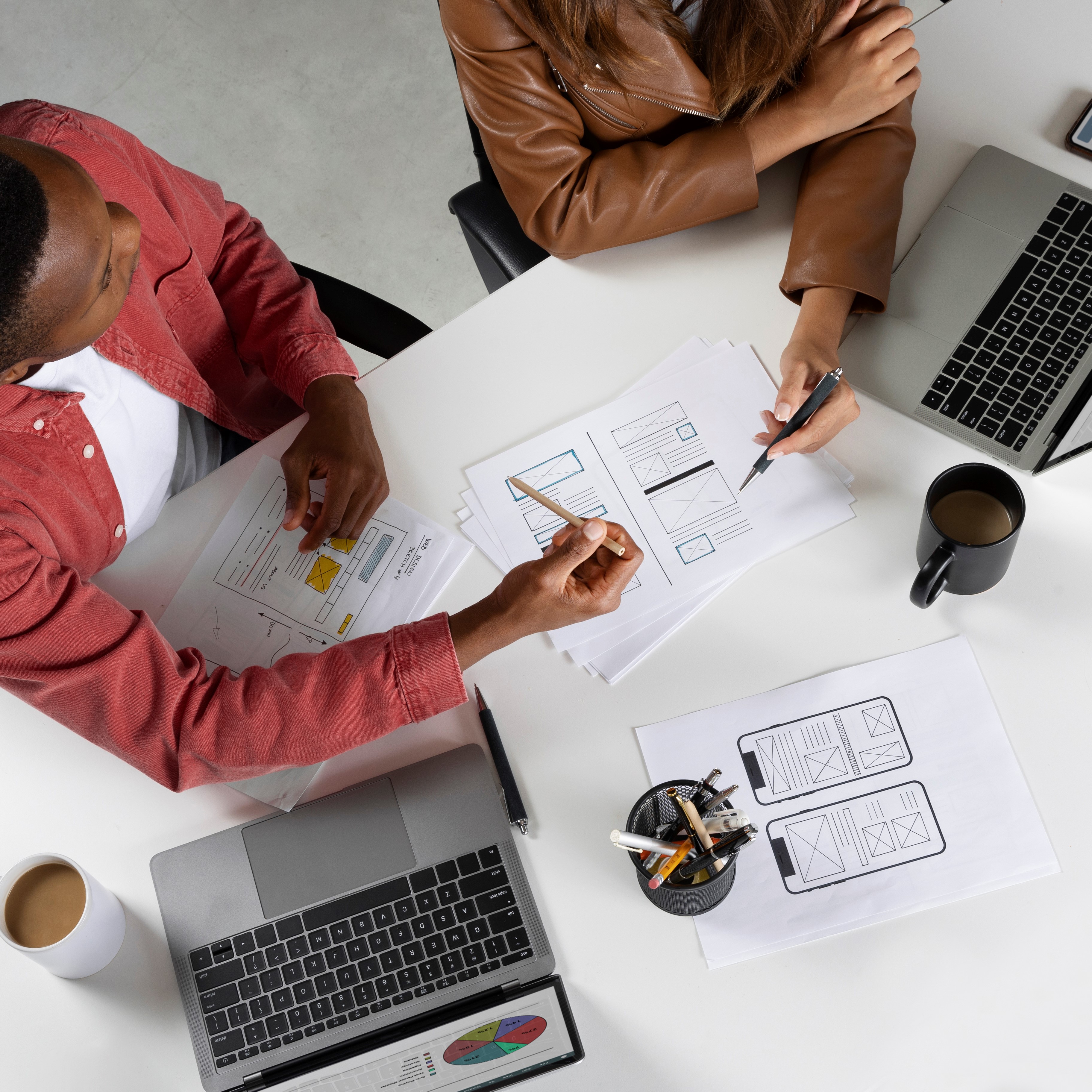 top-view-people-working-with-laptops